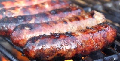 Sausages Sizzling on a BBQ Grill